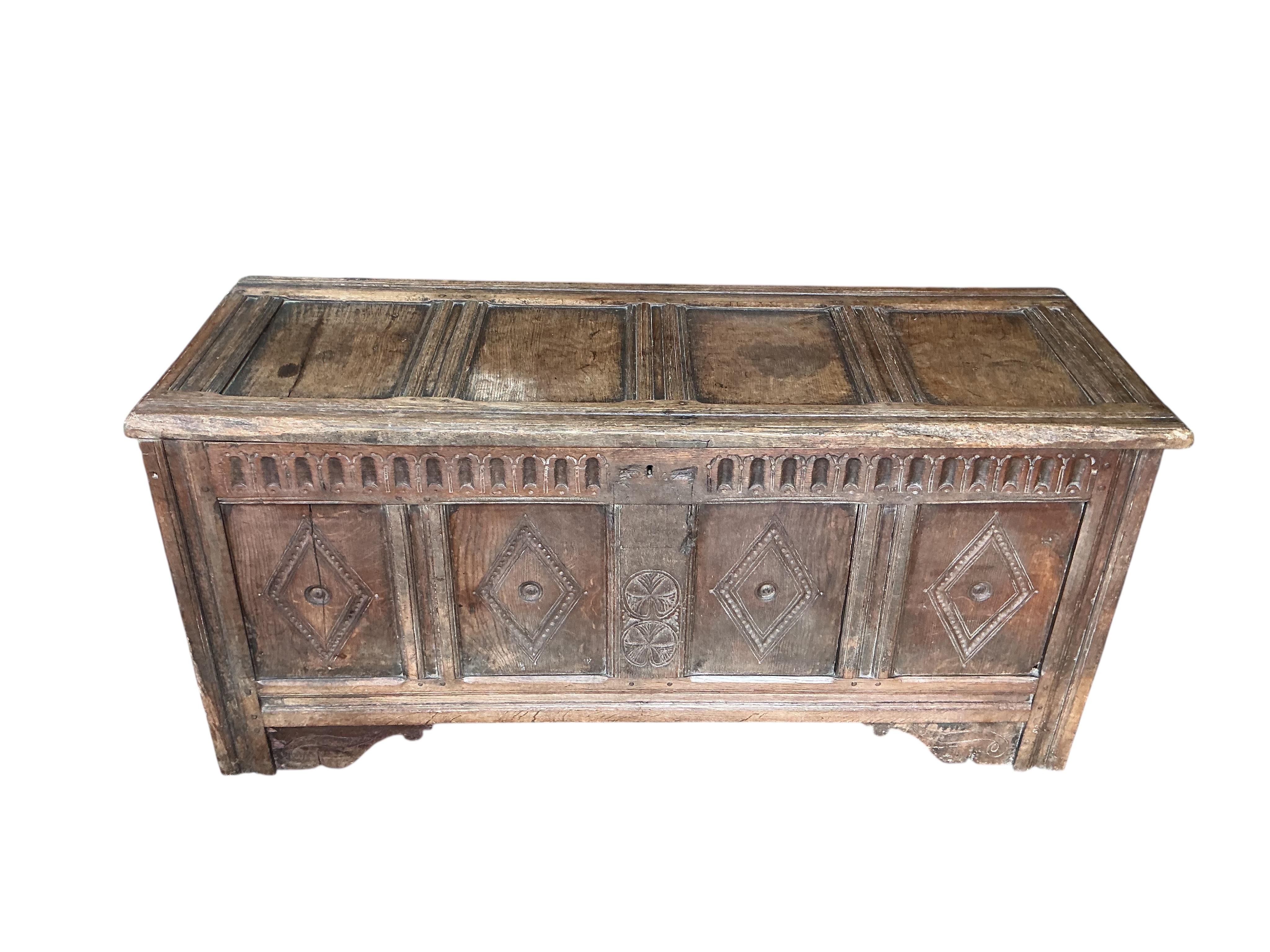 A carved oak coffer, width 146cm, depth 53cm, height 67cm